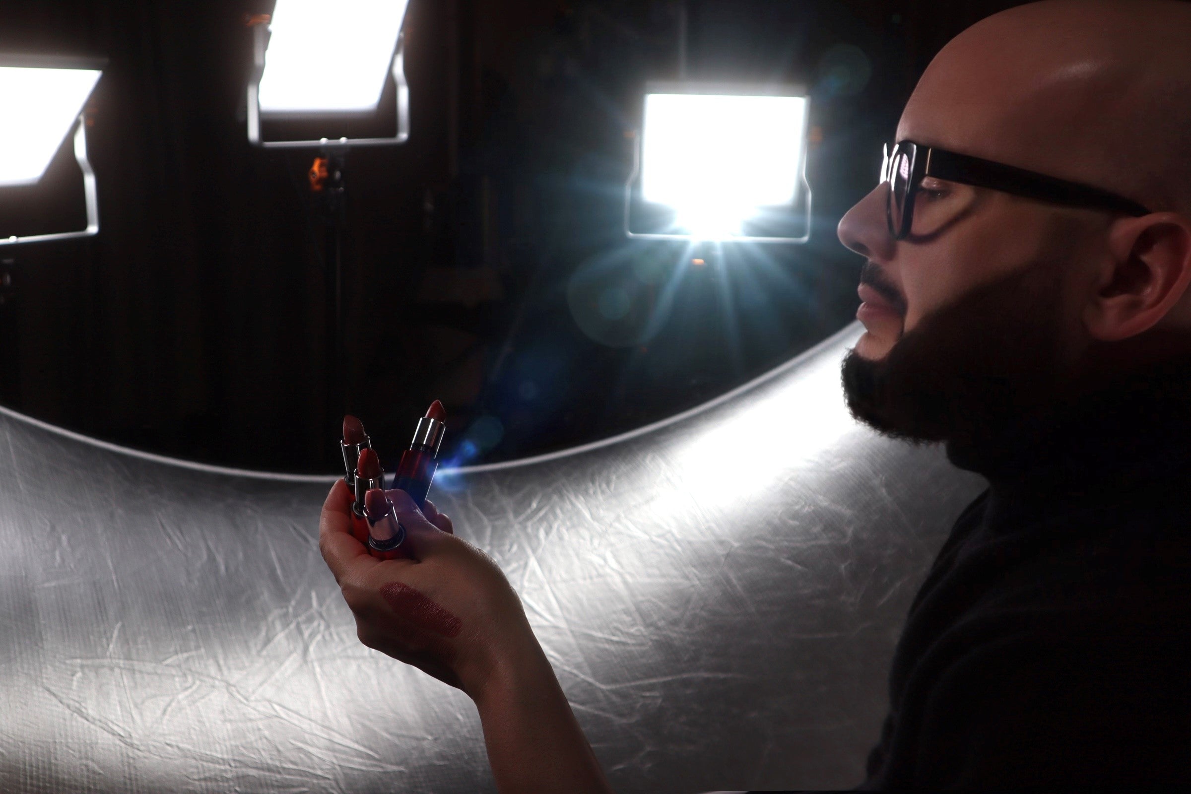 Le Métier de Beauté | Colour Director Mikey Castillo holding Colour Core Lipsticks